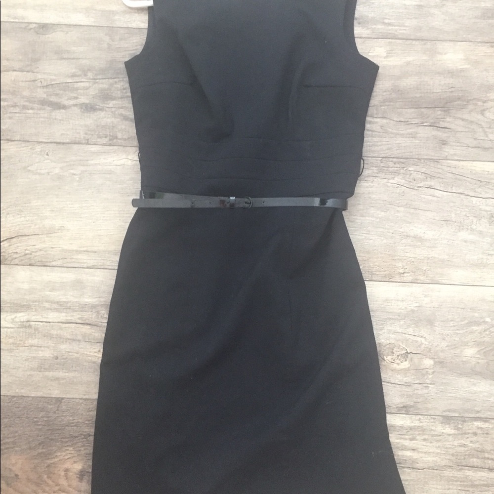 H&M black dress. Zippered back with black belt.